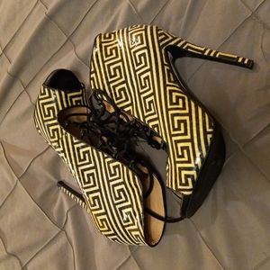 Black and white ankle tie up boots